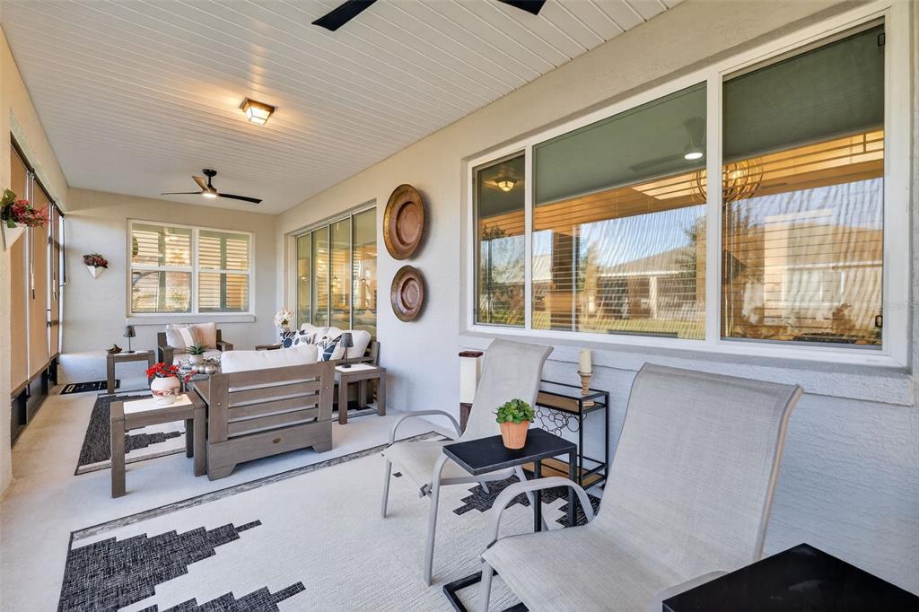 8433 Southwest 98th Terrace Road Ocala, FL 34481 - Photo 15 of 30 a living room with patio furniture and a large window