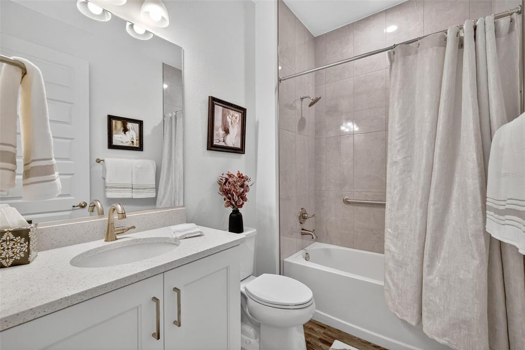 8433 Southwest 98th Terrace Road Ocala, FL 34481 - Photo 24 of 30 a bathroom with a sink a toilet and shower
