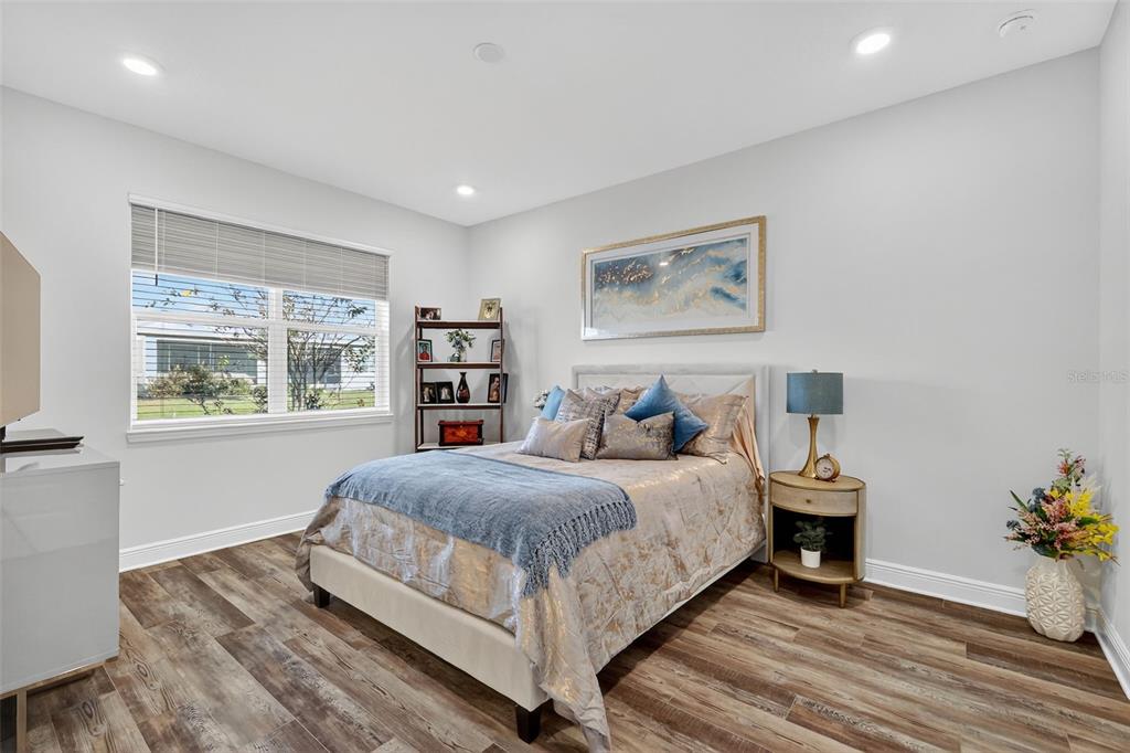 8433 Southwest 98th Terrace Road Ocala, FL 34481 - Photo 25 of 30 a bedroom with a bed and a large window