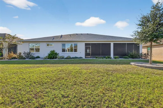 a front view of house with yard and outdoor seating