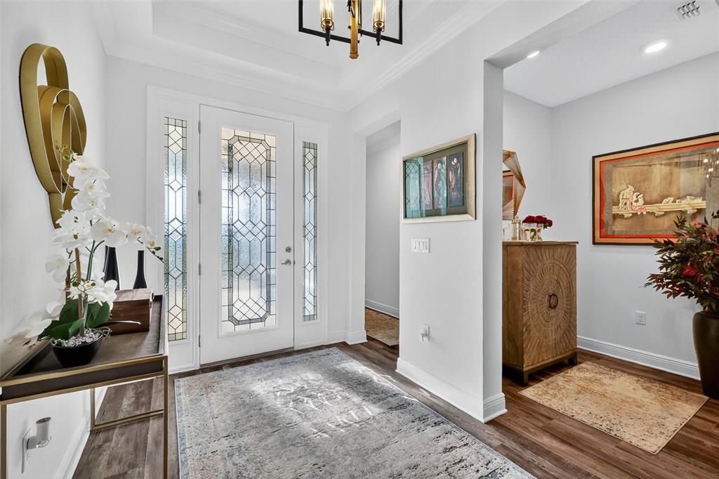 8433 Southwest 98th Terrace Road Ocala, FL 34481 - Photo 5 of 30 a view of a livingroom with wooden floor and a flat screen tv