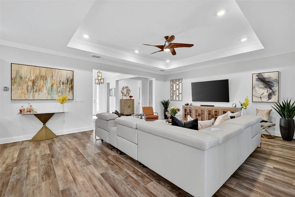 8433 Southwest 98th Terrace Road Ocala, FL 34481 - Photo 8 of 30 a living room with furniture and a flat screen tv