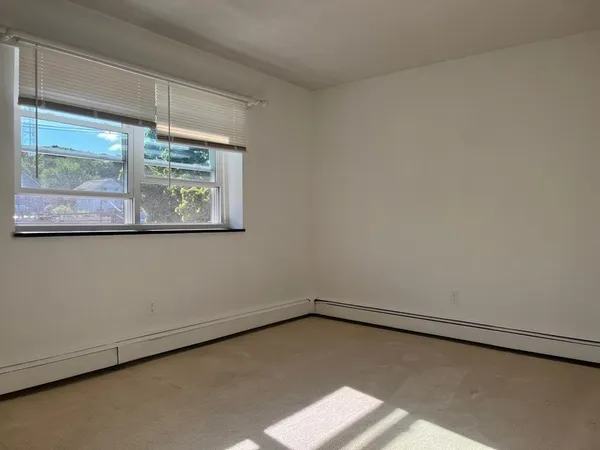 a view of a room that has a window in it