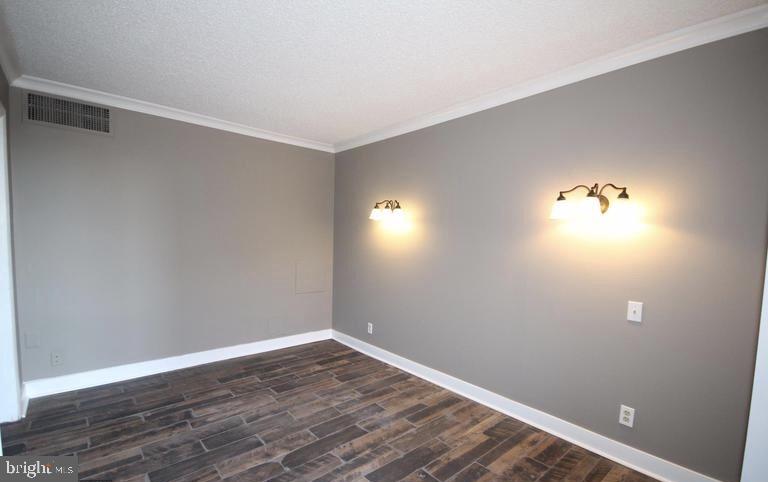 6800 Fleetwood Road, Unit 214 McLean, VA 22101 - Photo 13 of 22 a view of room with hardwood floor and window