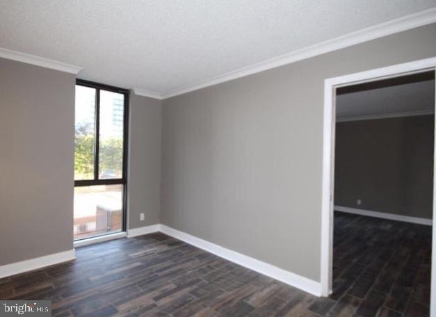 6800 Fleetwood Road, Unit 214 McLean, VA 22101 - Photo 14 of 22 an empty room with wooden floor and windows