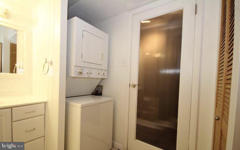 6800 Fleetwood Road, Unit 214 McLean, VA 22101 - Photo 15 of 22 a bathroom with a sink and a mirror
