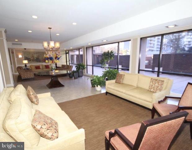 6800 Fleetwood Road, Unit 214 McLean, VA 22101 - Photo 18 of 22 a living room with furniture and a large window