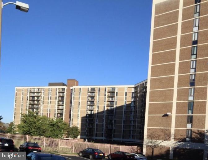 6800 Fleetwood Road, Unit 214 McLean, VA 22101 - Photo 21 of 22 a view of a building with a street