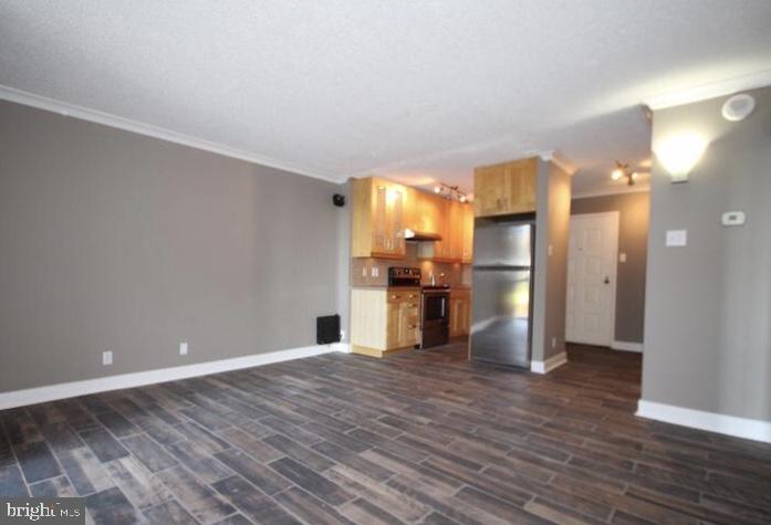 6800 Fleetwood Road, Unit 214 McLean, VA 22101 - Photo 3 of 22 a view of kitchen with wooden floor