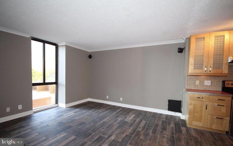6800 Fleetwood Road, Unit 214 McLean, VA 22101 - Photo 4 of 22 wooden floor in an empty room with a window
