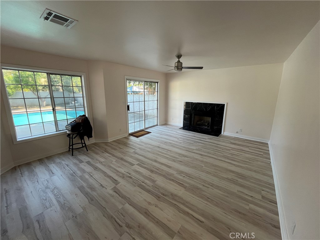 7522 Balcom Avenue Reseda, CA 91335 - Photo 4 of 22 wooden floor in an empty room with a window