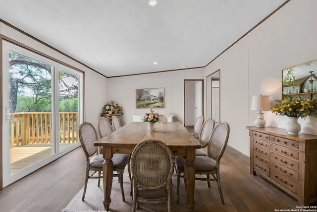 a view of a dining room with furniture window and outside view