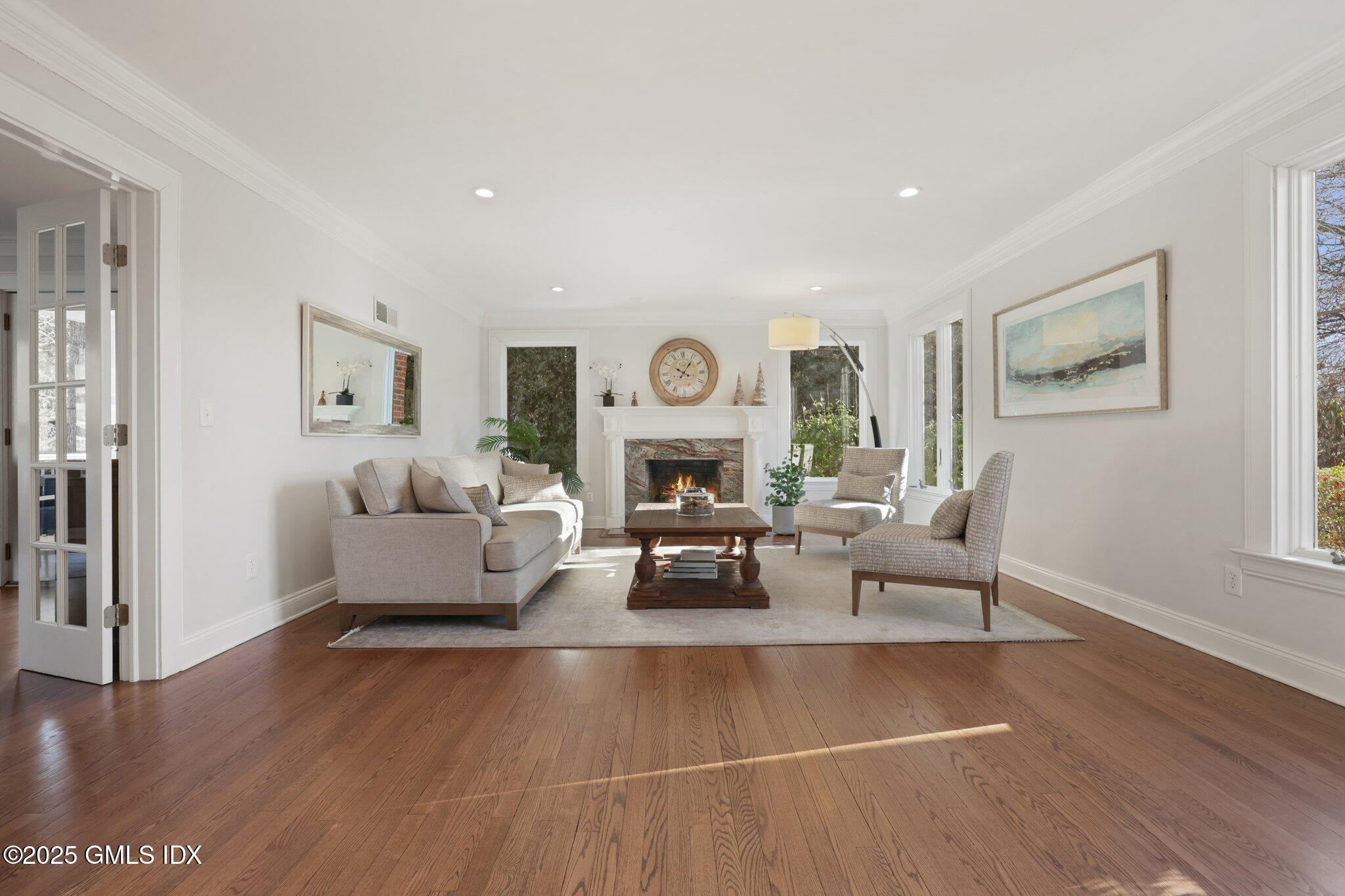 81 Hendrie Avenue Riverside, CT 06878 - Photo 12 of 35 a living room with furniture and a fireplace