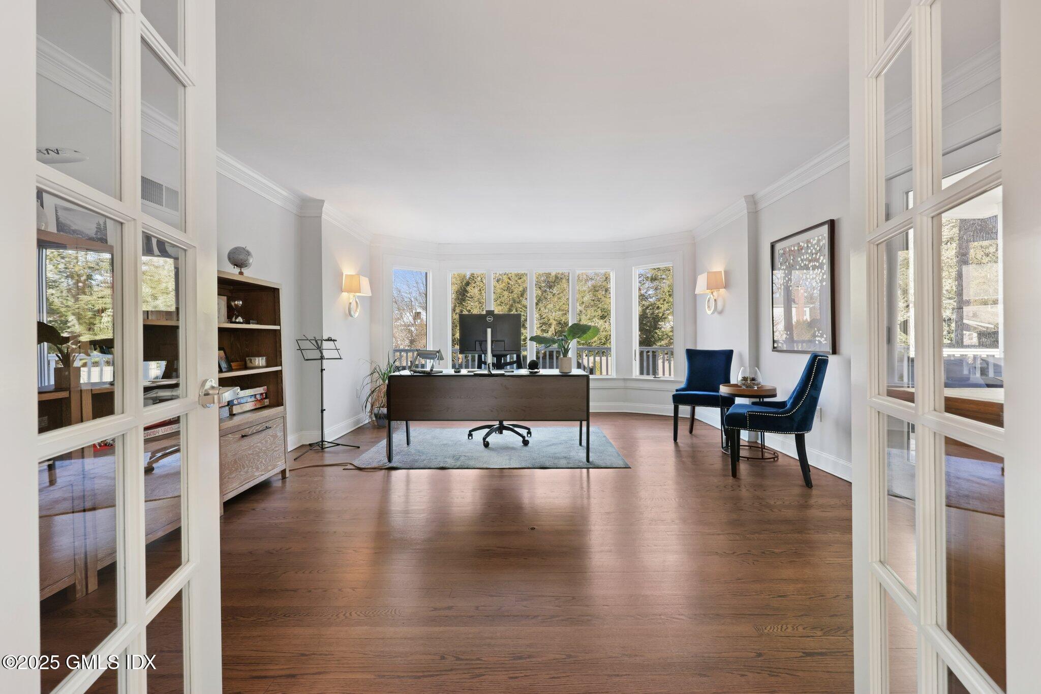 81 Hendrie Avenue Riverside, CT 06878 - Photo 13 of 35 a living room with furniture wooden floor and a flat screen tv