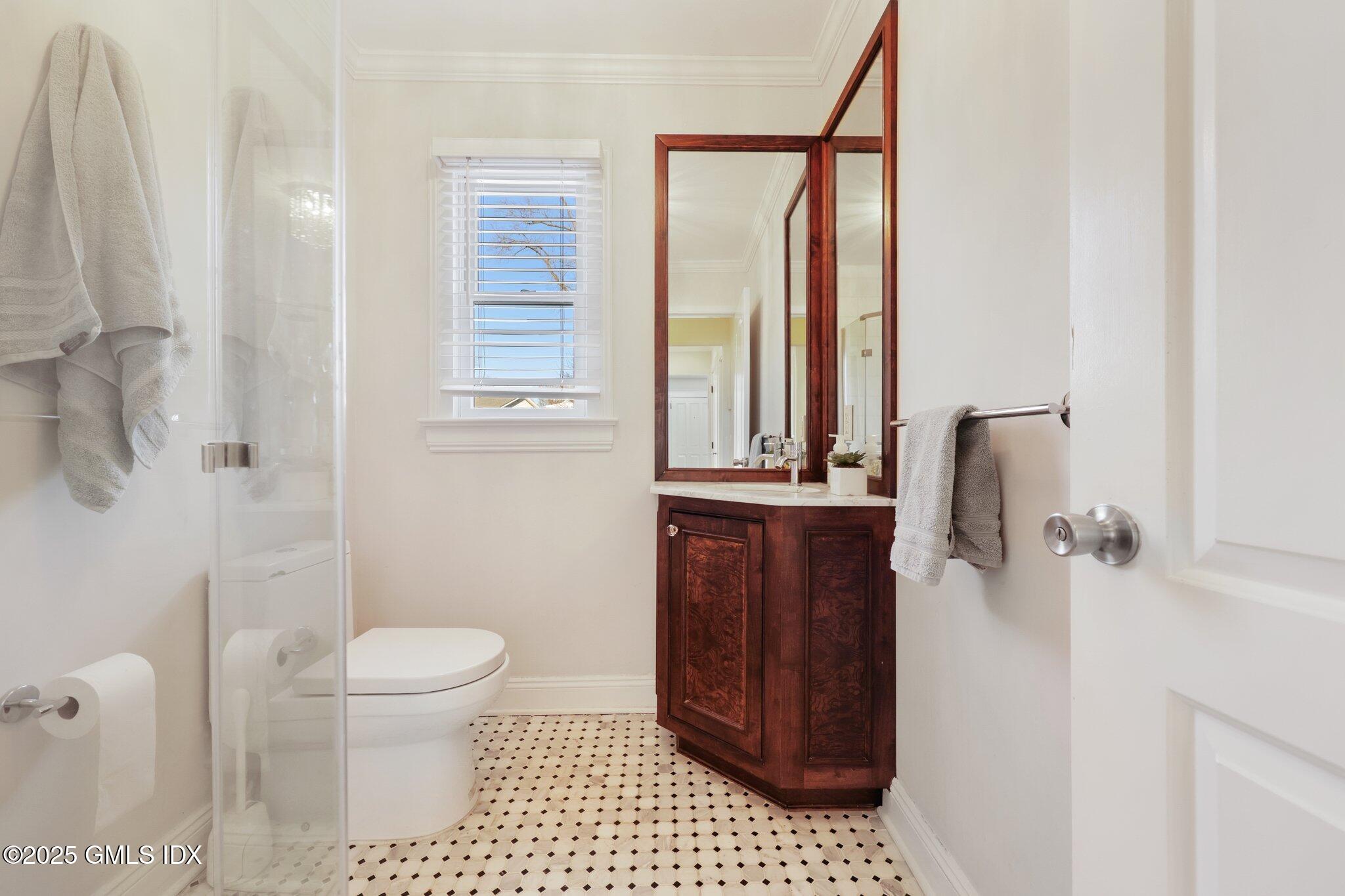 81 Hendrie Avenue Riverside, CT 06878 - Photo 17 of 35 a bathroom with a toilet and a shower