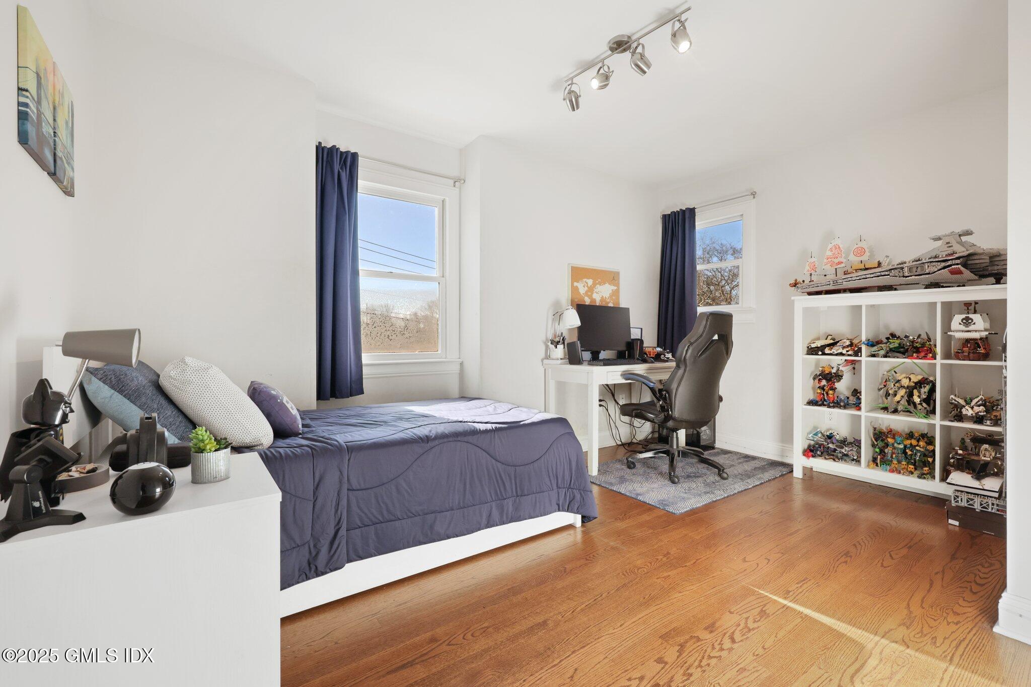 81 Hendrie Avenue Riverside, CT 06878 - Photo 24 of 35 a bedroom with a workspace
