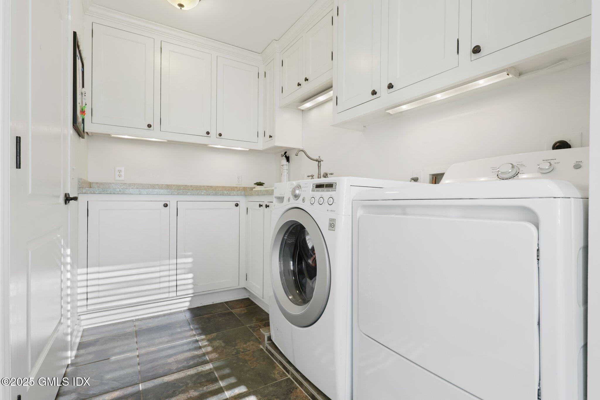 81 Hendrie Avenue Riverside, CT 06878 - Photo 26 of 35 a utility room with dryer and washer