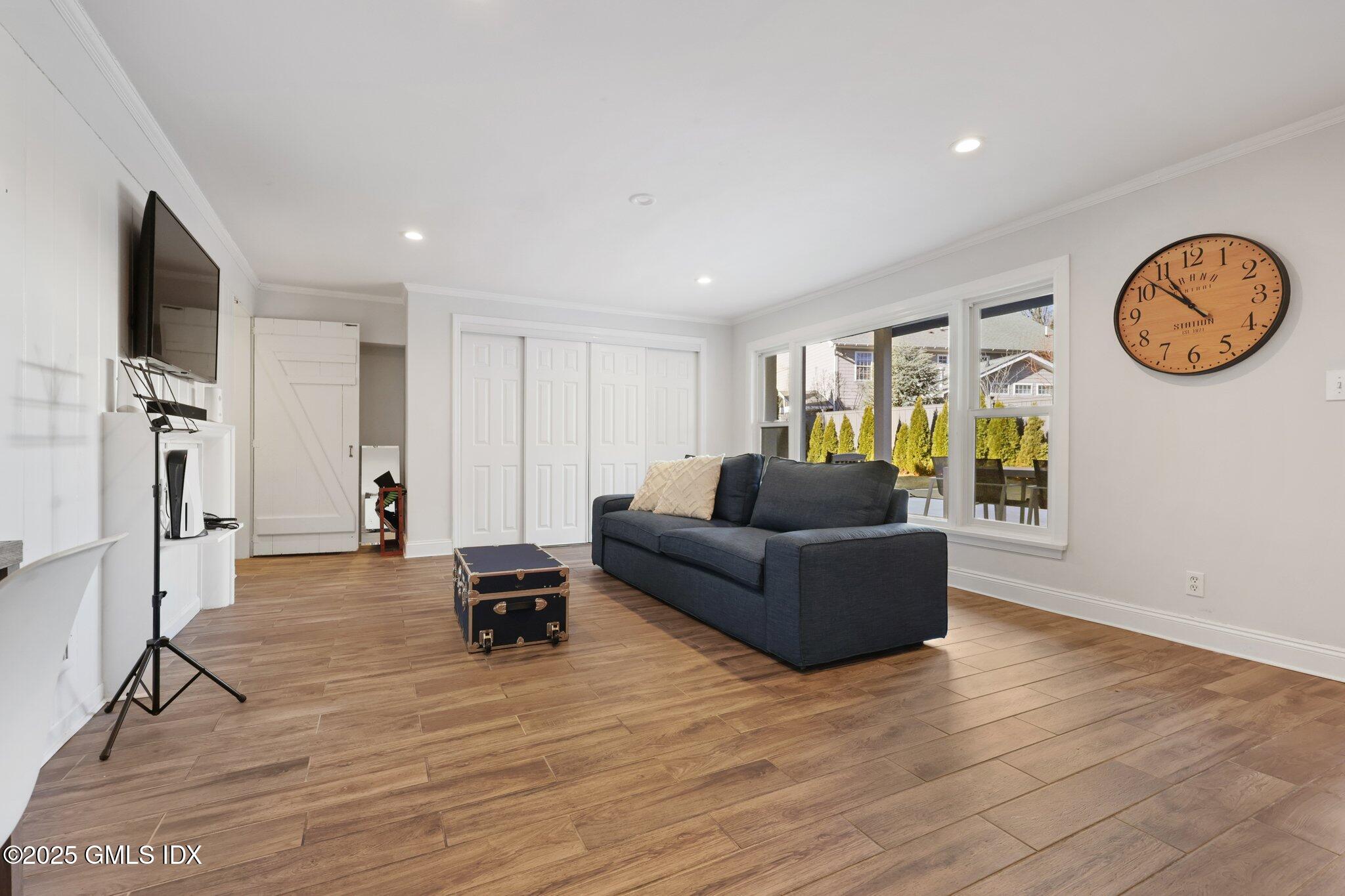 81 Hendrie Avenue Riverside, CT 06878 - Photo 28 of 35 a living room with furniture and a window
