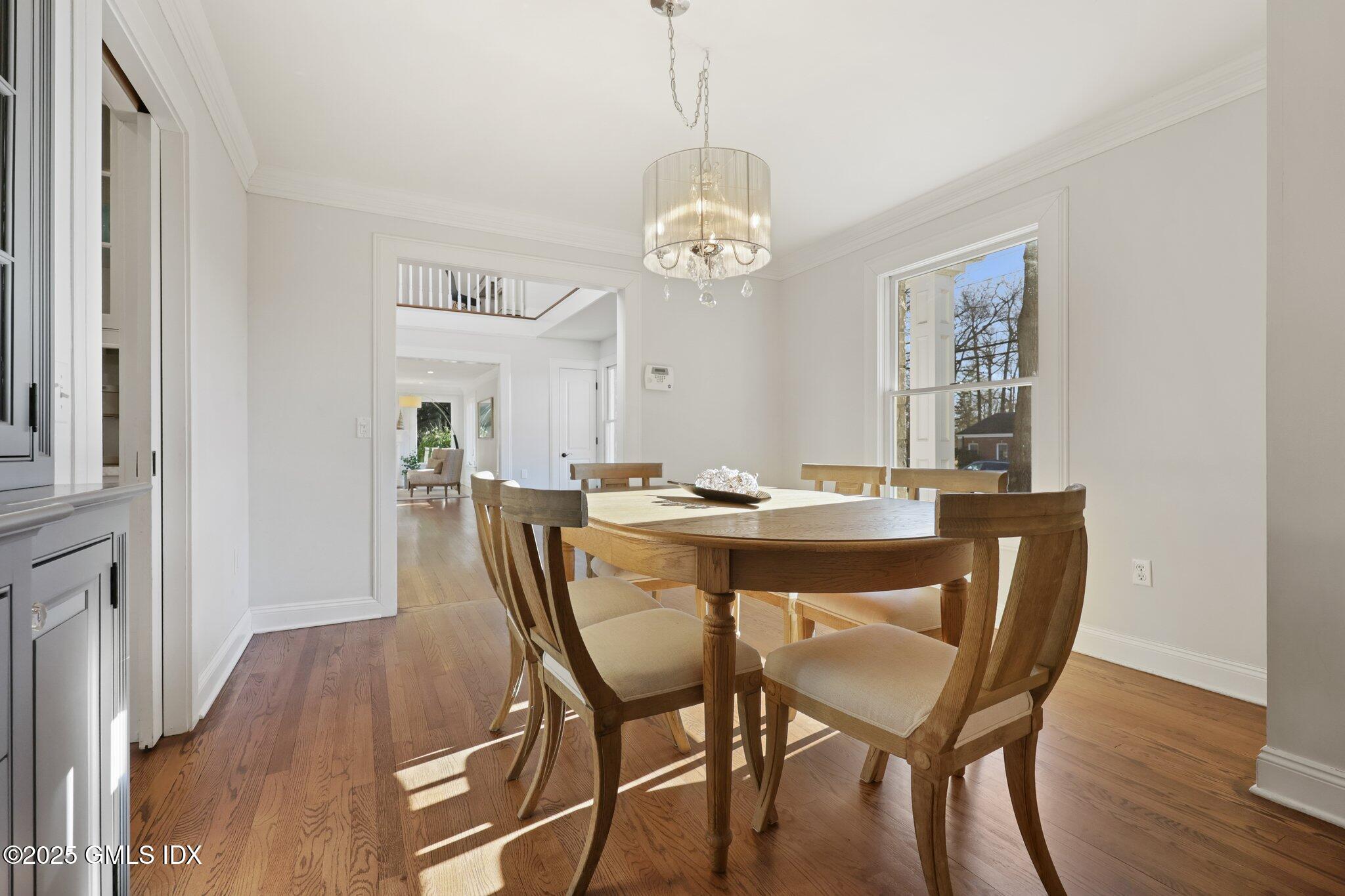 81 Hendrie Avenue Riverside, CT 06878 - Photo 10 of 35 a view of a dining room with furniture wooden floor and chandelier