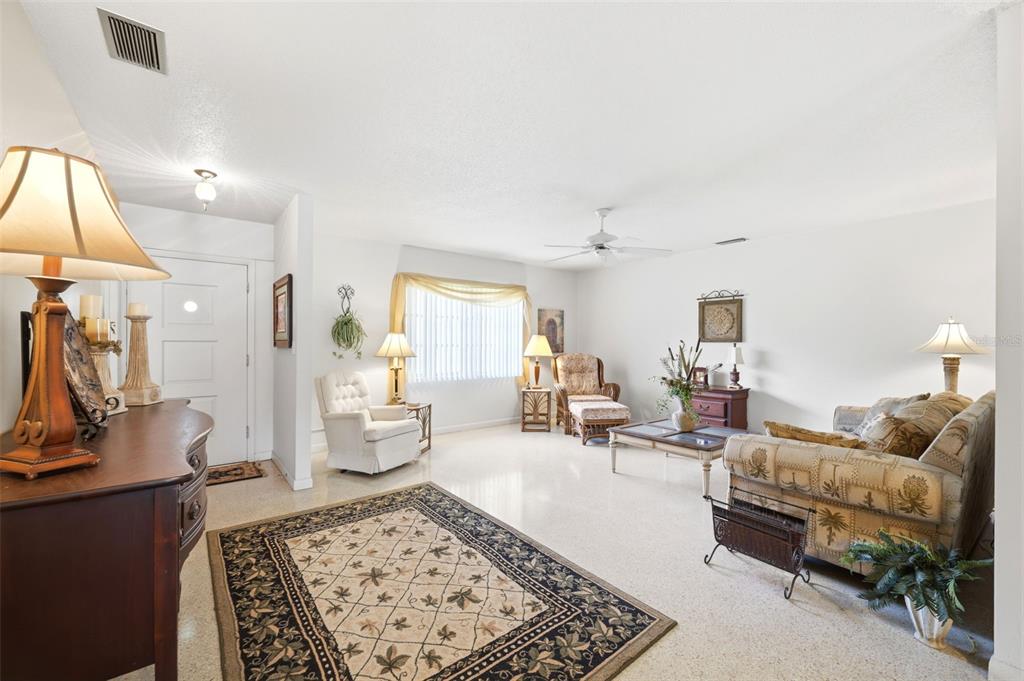 1830 South Mandarin Terrace Inverness, FL 34450 - Photo 8 of 47 a living room with furniture and a lamp