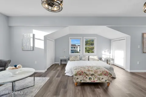 a bedroom with a bed and a table in it