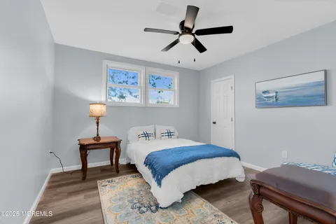 a bedroom with a bed and a table in it