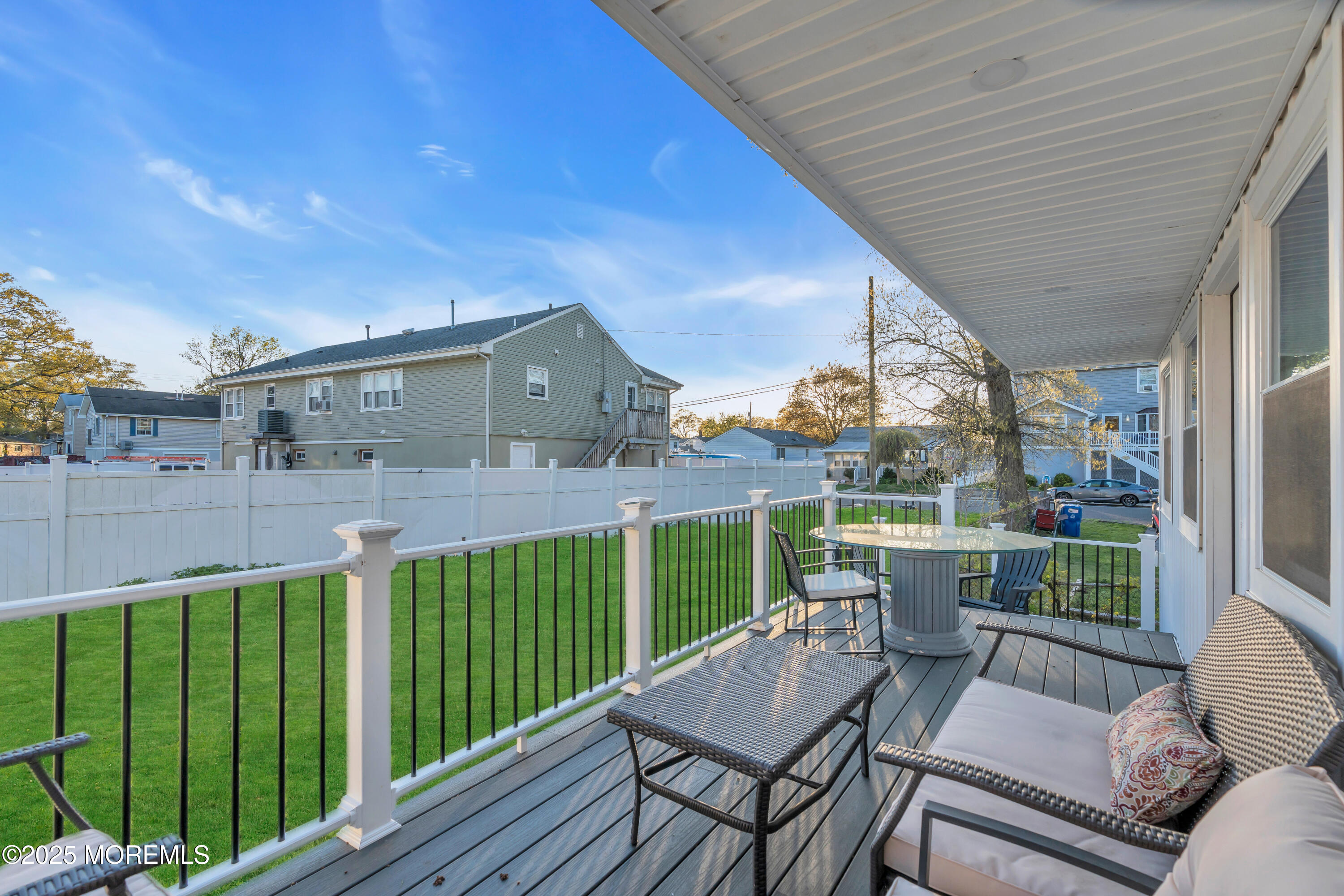 166 Shore Boulevard Keansburg, NJ 07734 - Photo 32 of 36 a view of a chair and tables in the balcony