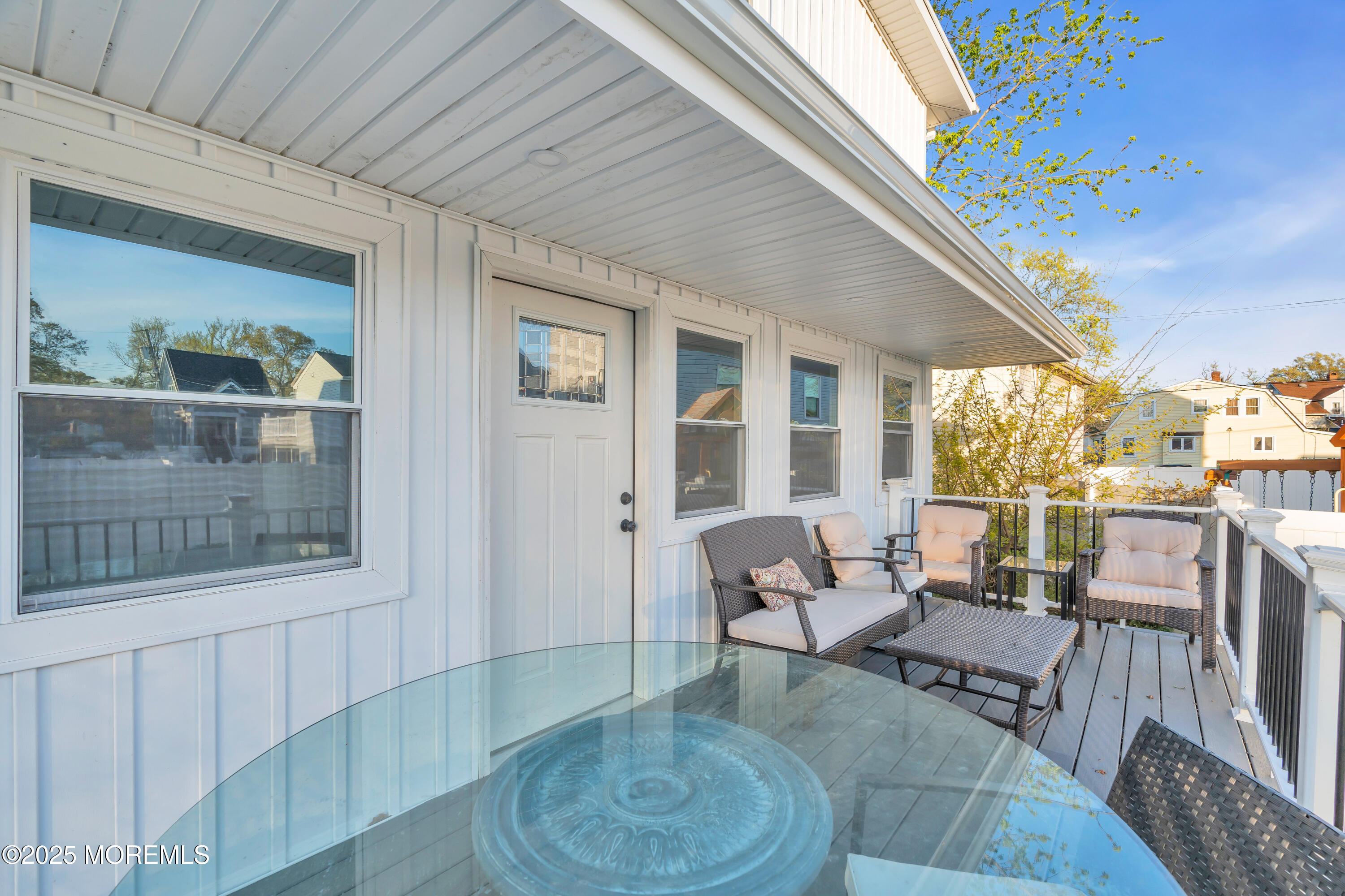 166 Shore Boulevard Keansburg, NJ 07734 - Photo 33 of 36 a living room with furniture and a floor to ceiling window