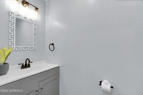 a bathroom with a sink and mirror