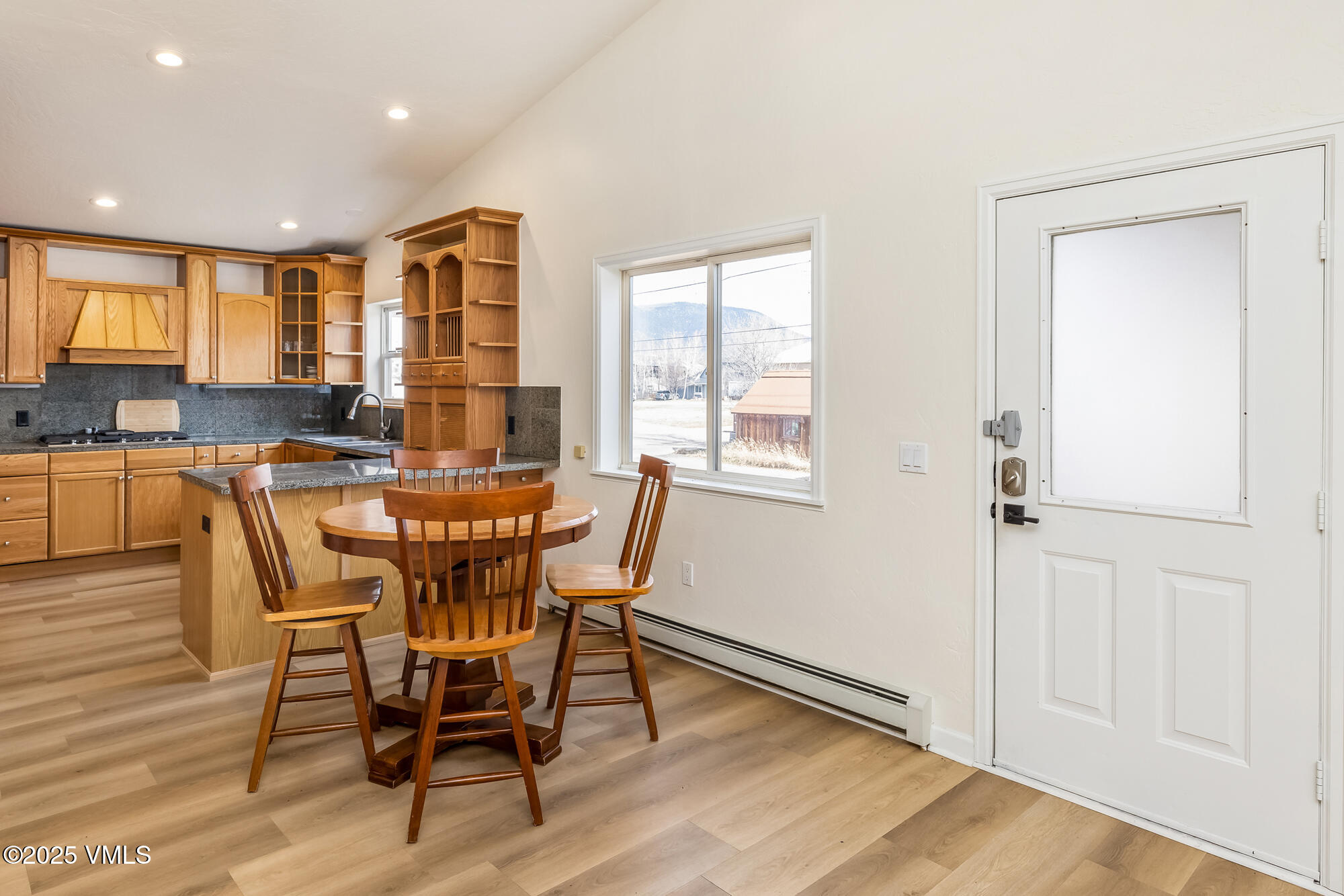 214 Capitol Street Eagle, CO 81631 - Photo 15 of 32 a view of a dining room with furniture and wooden floor