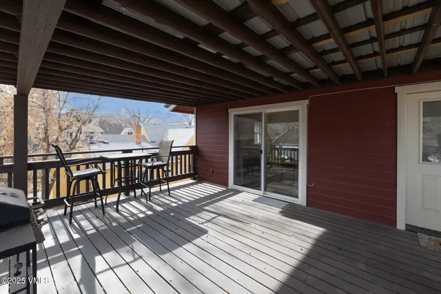 a view of a balcony with wooden floor