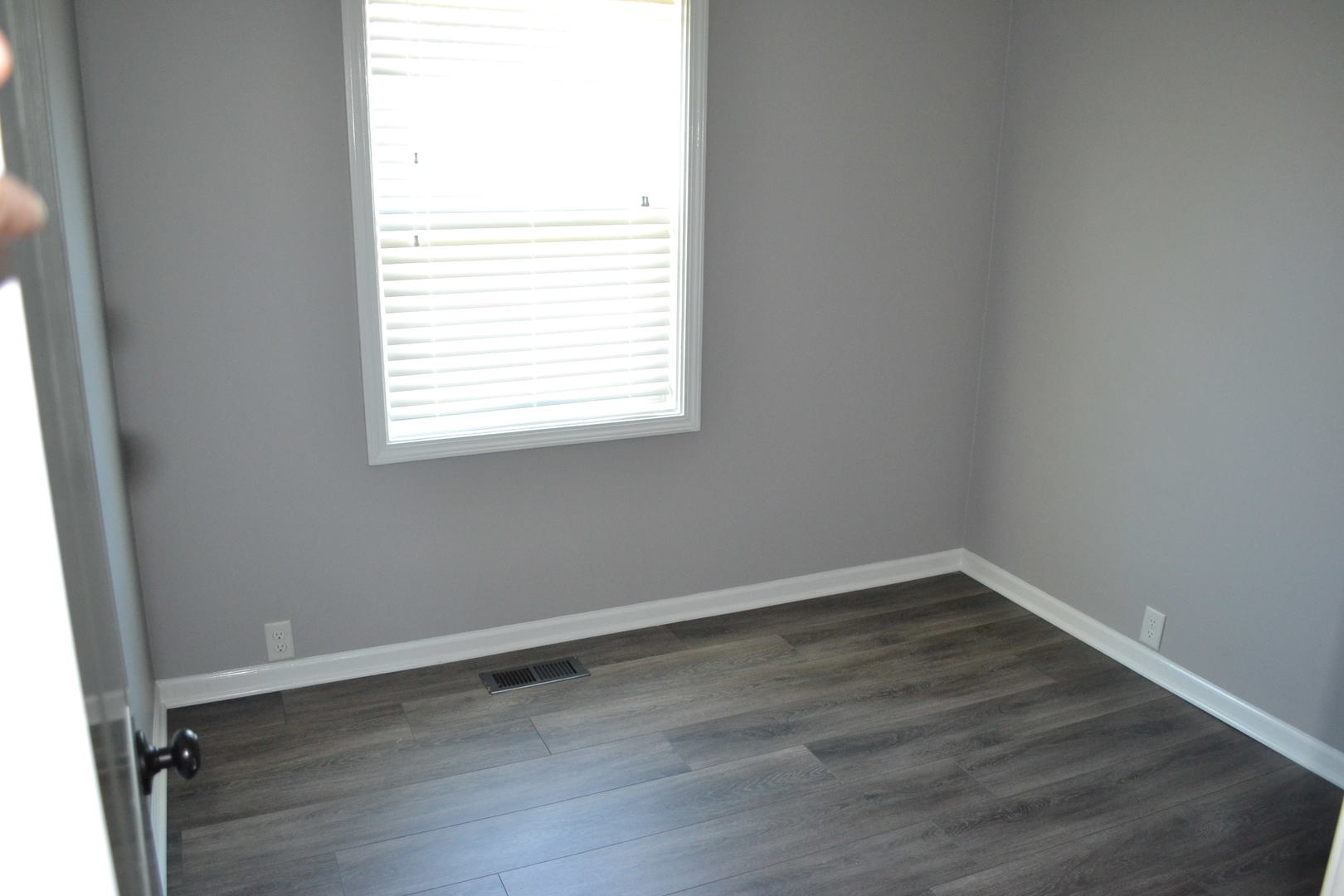 307 Karen Avenue Romeoville, IL 60446 - Photo 11 of 20 an empty room with wooden floor and windows