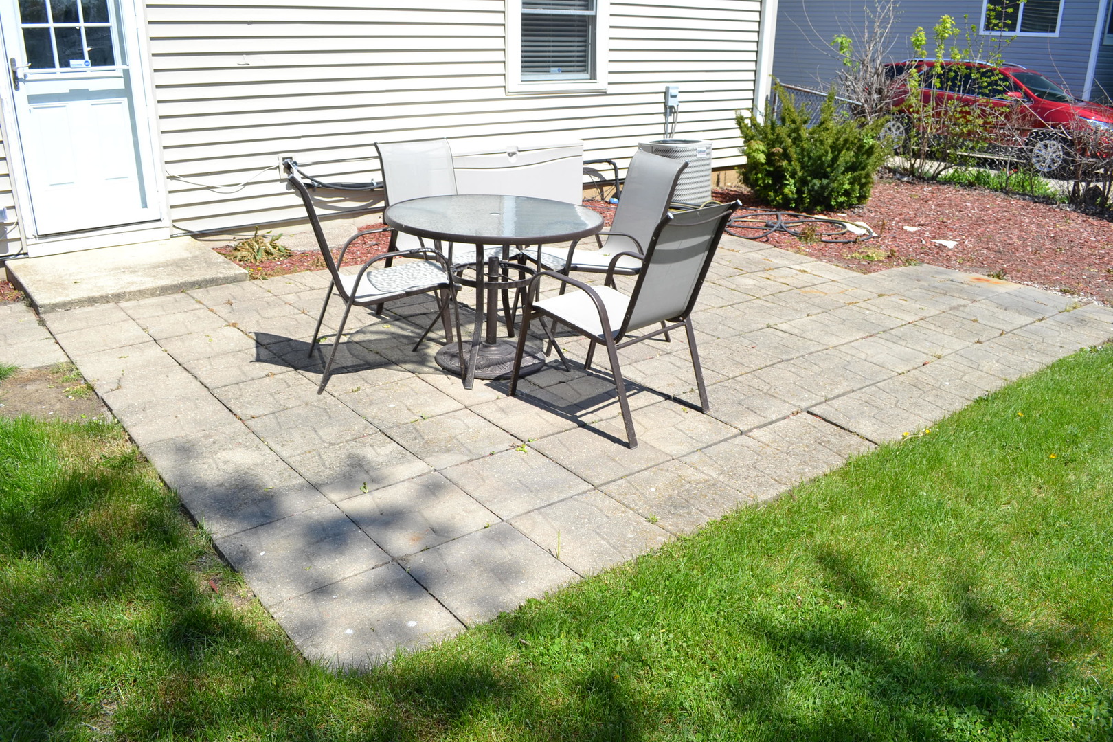 307 Karen Avenue Romeoville, IL 60446 - Photo 20 of 20 a view of a backyard with table and chairs and potted plants