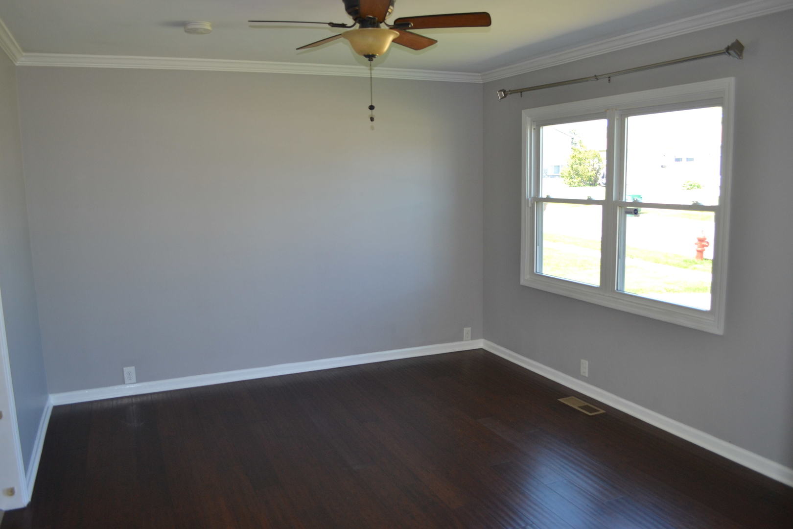 307 Karen Avenue Romeoville, IL 60446 - Photo 7 of 20 wooden floor in an empty room with a window