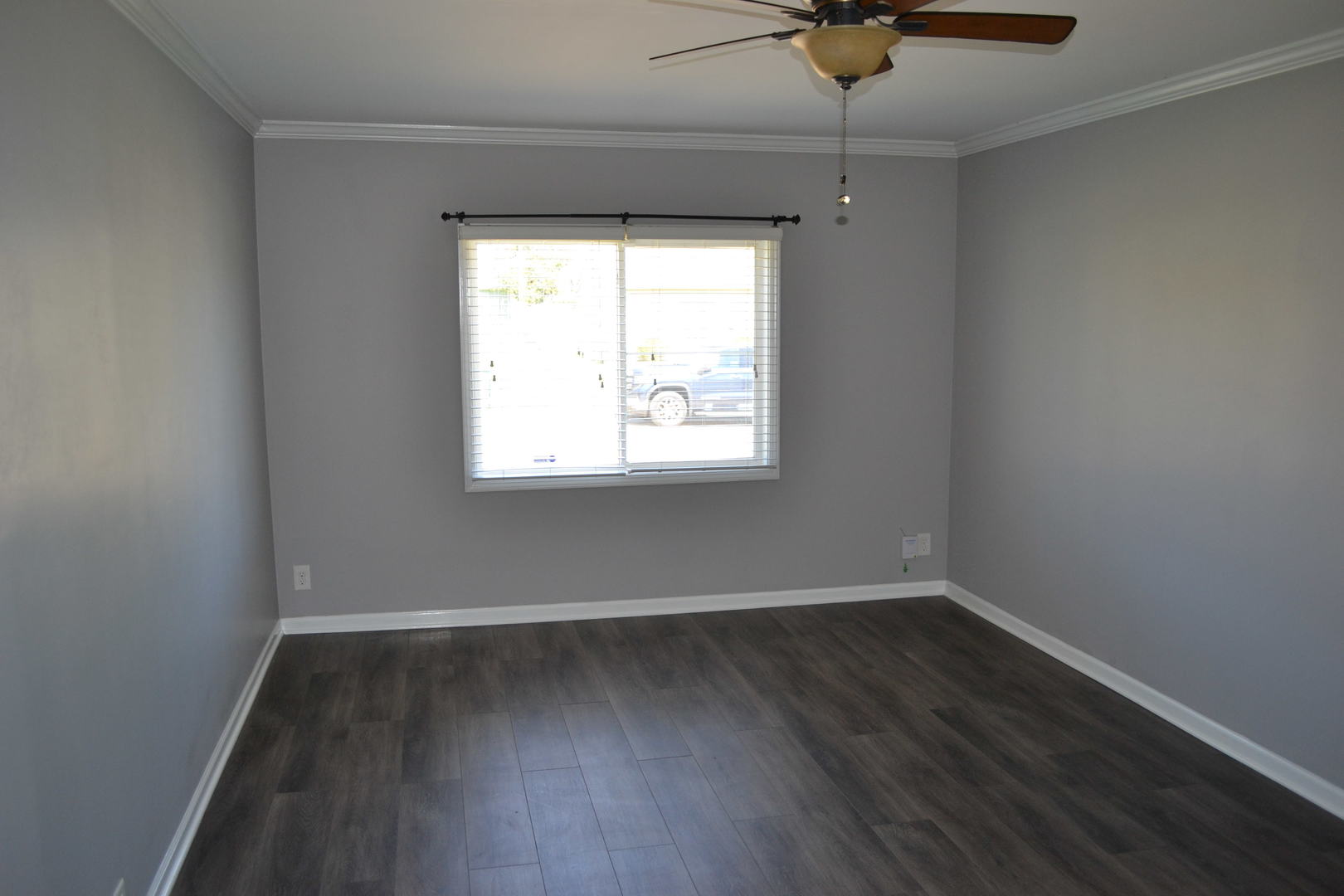 307 Karen Avenue Romeoville, IL 60446 - Photo 9 of 20 wooden floor in an empty room with a window