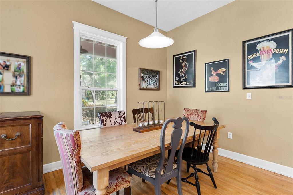 10616 Poe Street Leesburg, FL 34788 - Photo 23 of 54 a dining room with furniture and window
