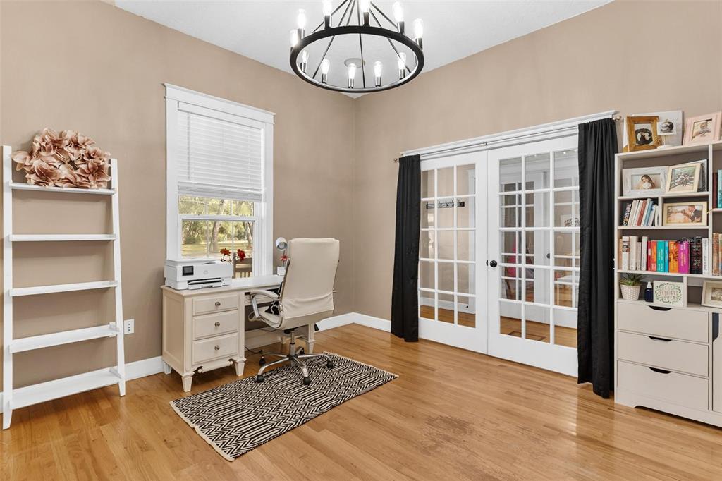 10616 Poe Street Leesburg, FL 34788 - Photo 27 of 54 a view of a workspace with furniture and a window