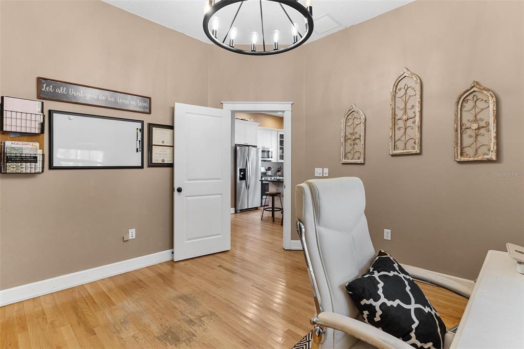 10616 Poe Street Leesburg, FL 34788 - Photo 28 of 54 a view of a livingroom with furniture and mirror
