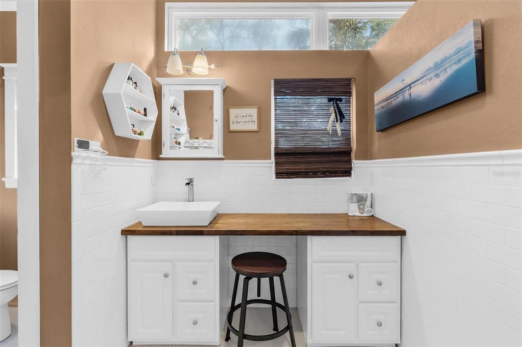 10616 Poe Street Leesburg, FL 34788 - Photo 34 of 54 a bathroom with a sink and a mirror