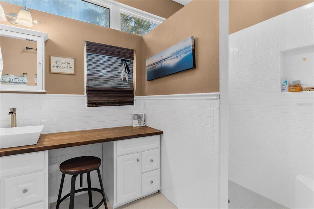 10616 Poe Street Leesburg, FL 34788 - Photo 35 of 54 a bathroom with a sink a vanity and a mirror