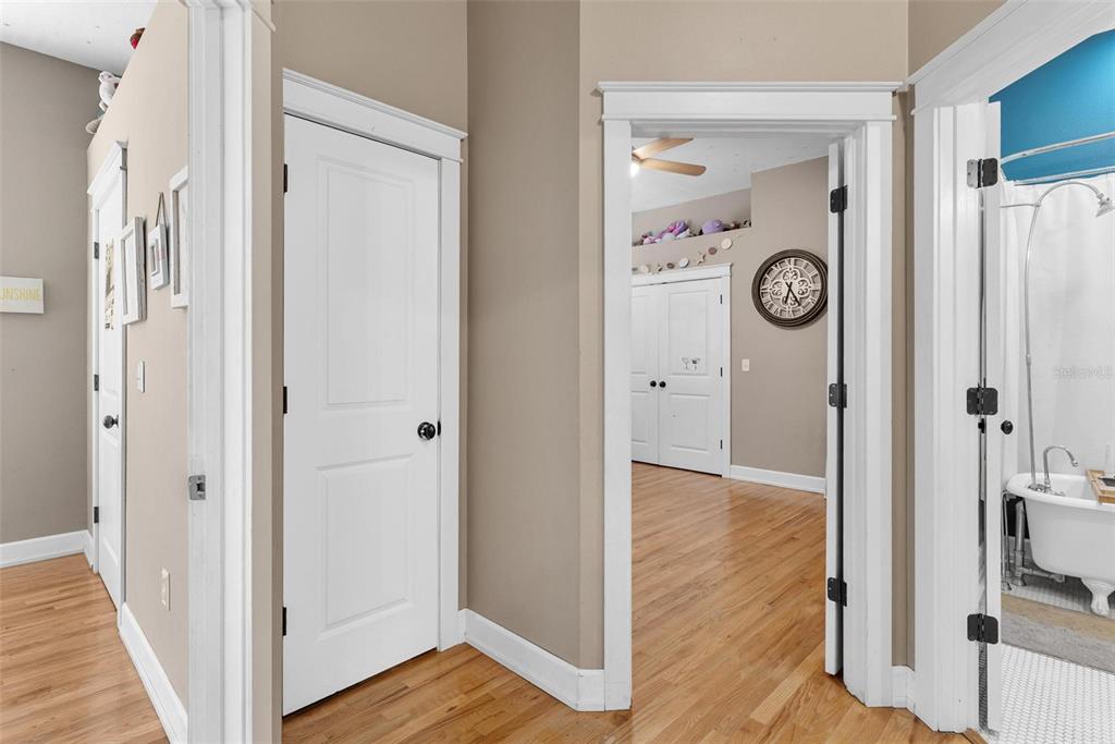 10616 Poe Street Leesburg, FL 34788 - Photo 37 of 54 a view of a hallway with wooden floor