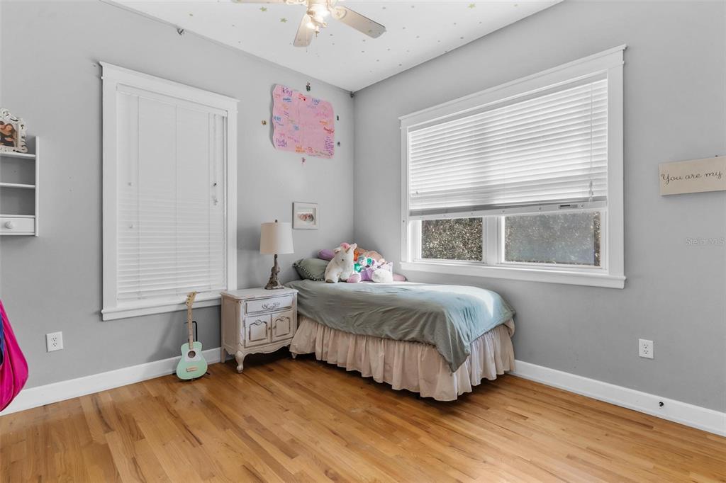 10616 Poe Street Leesburg, FL 34788 - Photo 38 of 54 a bedroom with a bed and a window