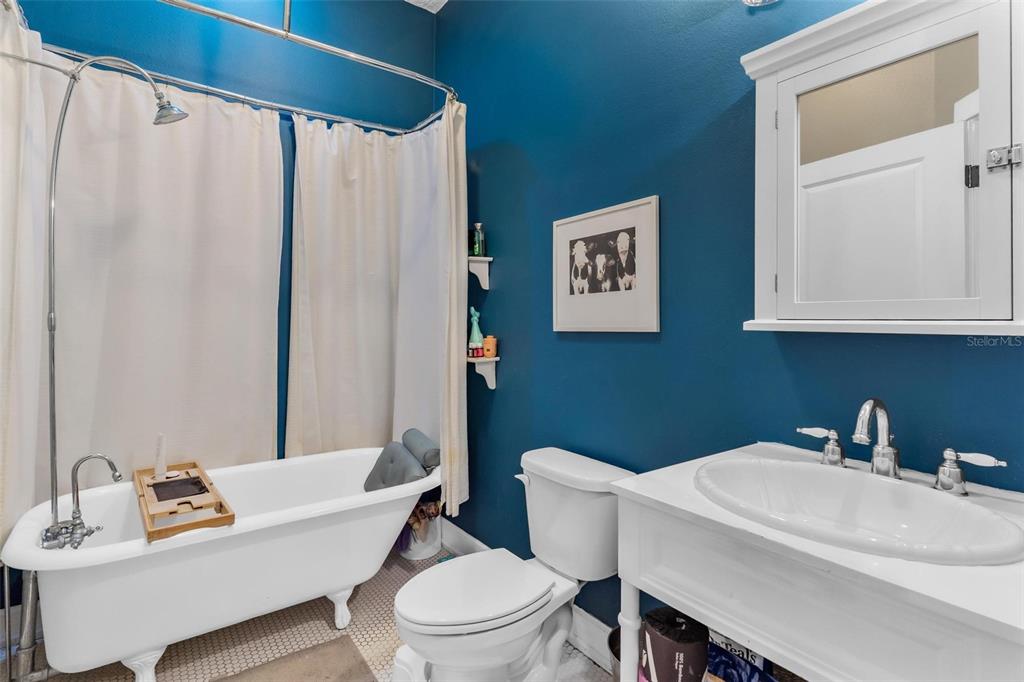 10616 Poe Street Leesburg, FL 34788 - Photo 40 of 54 a white toilet sitting next to a bathroom sink