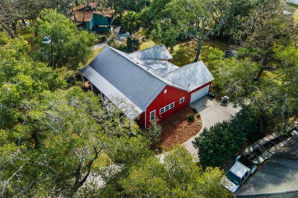 10616 Poe Street Leesburg, FL 34788 - Photo 48 of 54 an aerial view of a house with yard and outdoor seating