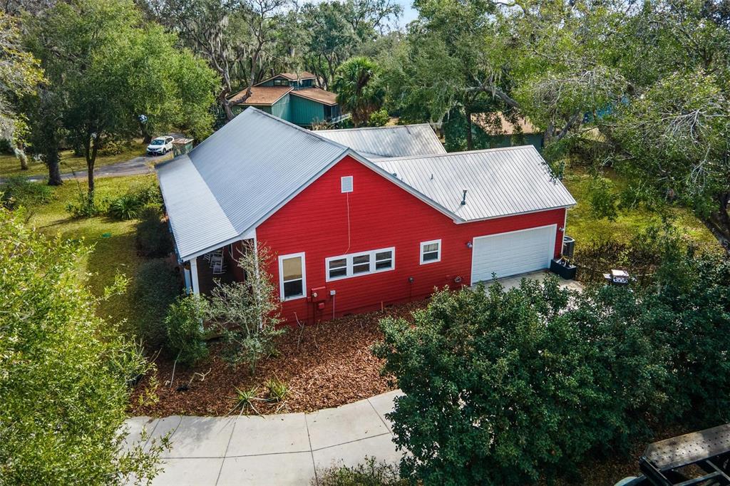 10616 Poe Street Leesburg, FL 34788 - Photo 49 of 54 a view of a house with a yard