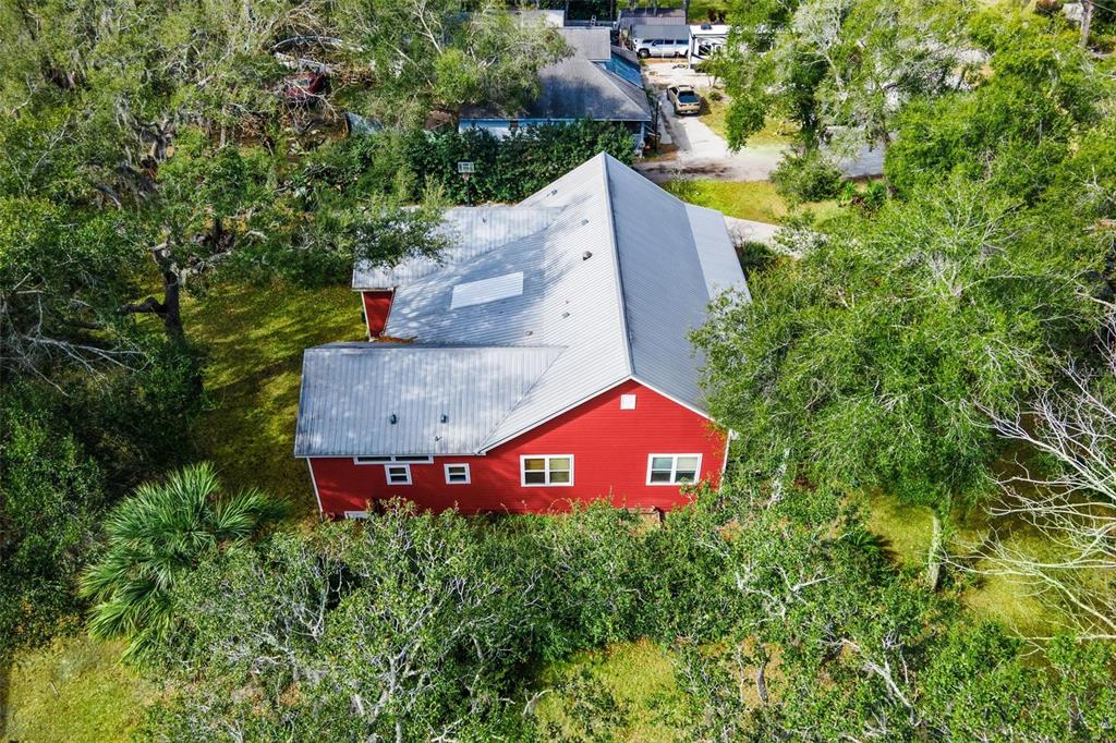 10616 Poe Street Leesburg, FL 34788 - Photo 50 of 54 an aerial view of a house with a yard