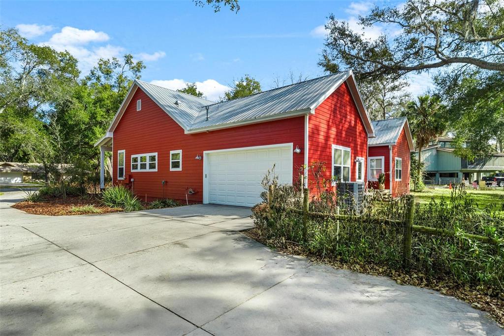 10616 Poe Street Leesburg, FL 34788 - Photo 7 of 54 a front view of a house with garden