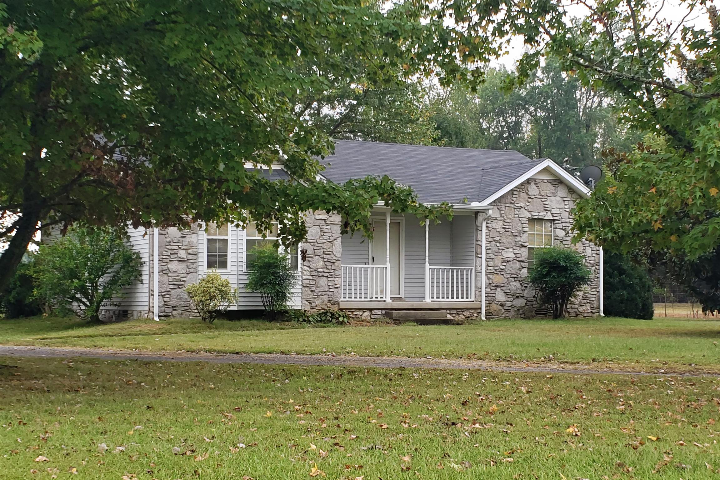3267 Friendship Road Cross Plains, TN 37049 - Photo 1 of 15 a front view of a house with a garden