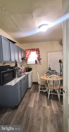 a kitchen with sink cabinets and window