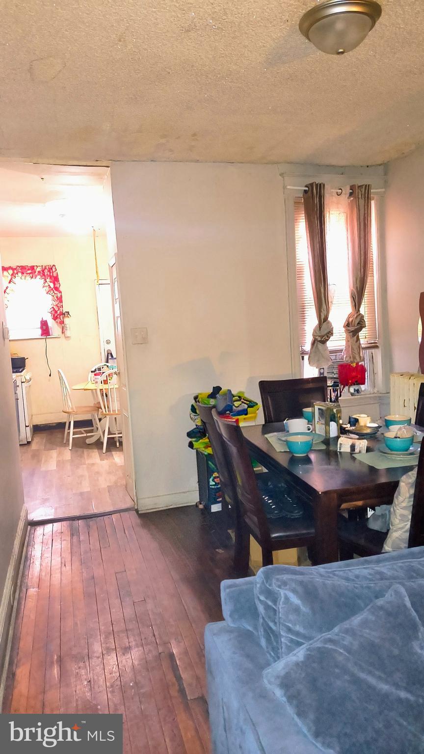 5330 Lesher Street Philadelphia, PA 19124 - Photo 8 of 14 a room with furniture and a wooden floor